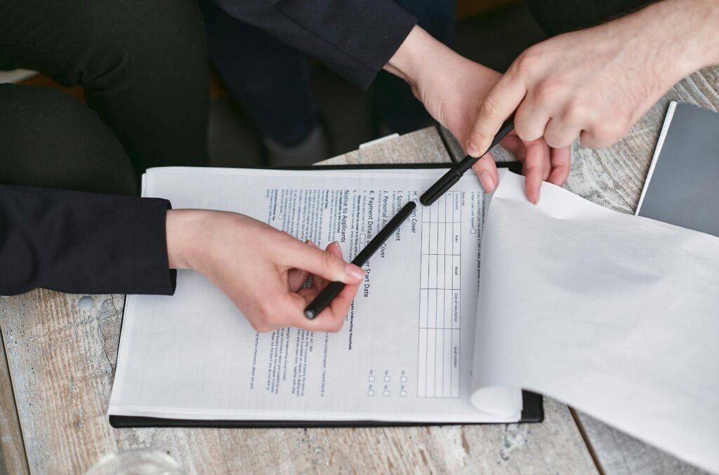 Property documentation papers including sale deed, registry papers, and legal documents for plot purchase