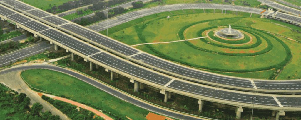 A car driving on the Yamuna Expressway showing long straight roads and open surroundings.